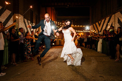bride and groom exiting their wedding at epic railyard in el paso texas