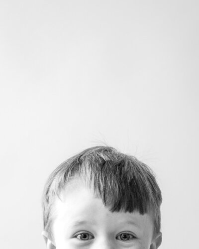 Black and white photograph of toddler boy.