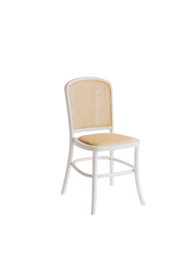 A white chair with Rattan back and light tan cushion.