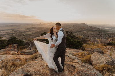 A couple celebrates on their elopement day with champagne in joshua tree national park
