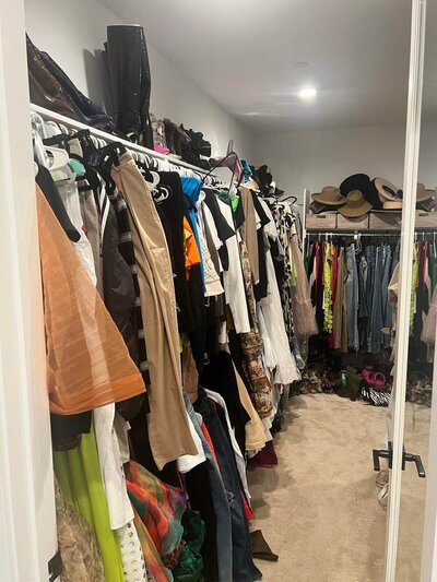 Messy, disorganized closet before Shaniece has worked on it.
