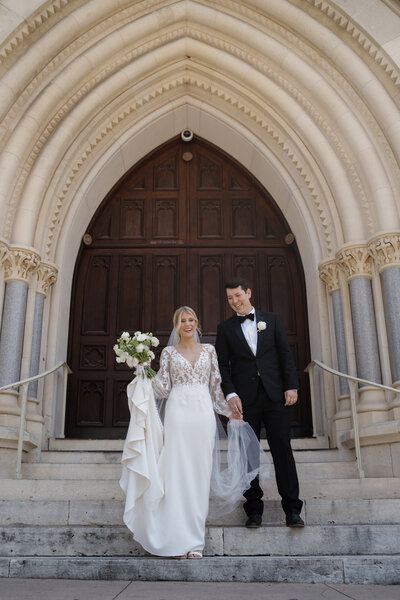 Bride and Groom walking down the steps of the chapel leaving their romantic Ceremony planned by Everlasting Events in Austin Texas