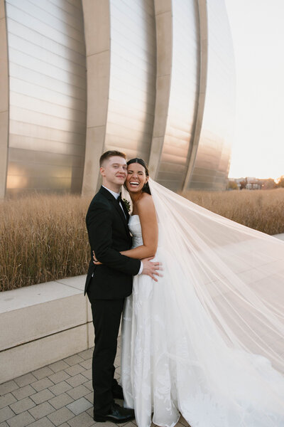 bride and groom dancing at wedding reception at boulevard brewery in kansas city missouri. Flash photography at reception during dancing to capture candid moments