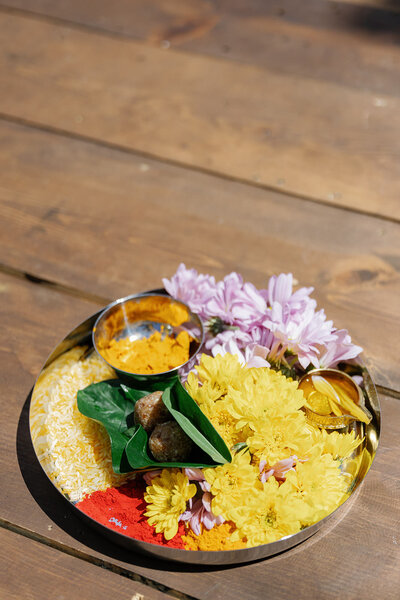 A silver plate with colorful flowers on it 