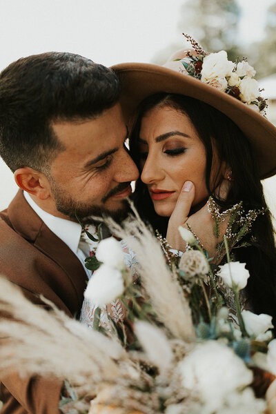 bride and groom holding each other