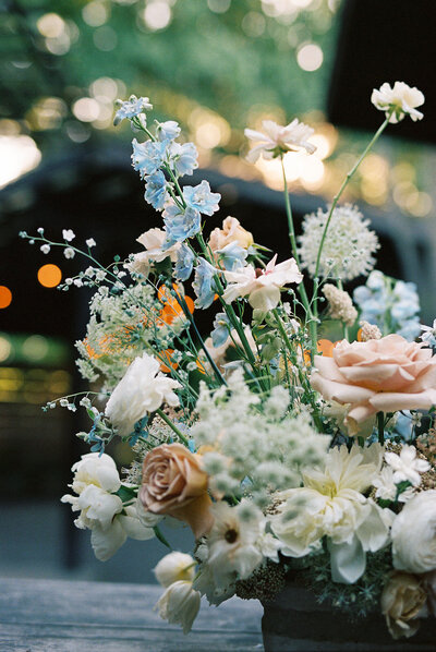 A Washington wedding photographer captures a stunning array of wedding flowers. The detailed image portrays a rustic and romantic floral arrangement.