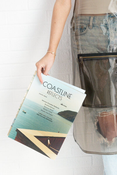 woman holding a magazine