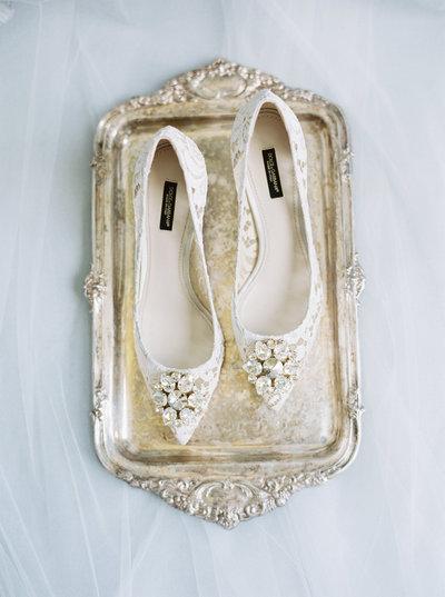 Heels sit on a gold tray.