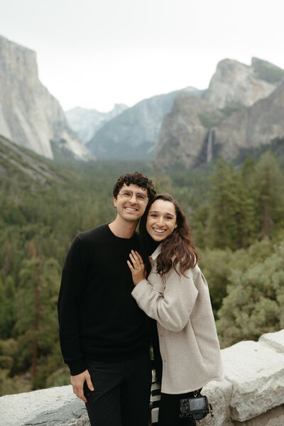Dolomites elopement photographers the Chaffins smile at the camera with mountains behind them