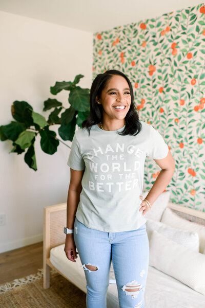 Woman in jeans and tee shirt smiling
