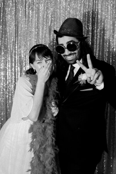 Couple laughs during their wedding reception on Elmwood School, Ottawa.