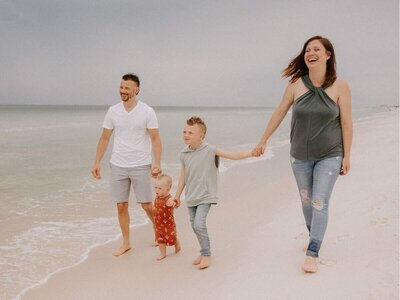 business systems consultant Caitlyn Gray with family at the beach