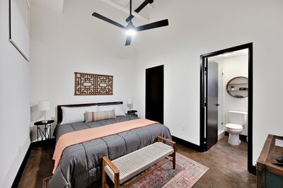 Master bedroom in this 2-bedroom, 2-bathroom luxury condo in the historic Behrens building in downtown Waco, TX