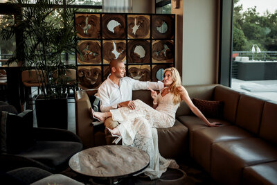 couple popping champagne after their tampa elopement