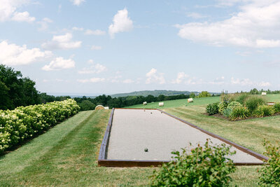 bocci courts and gardens with a bucolic field view