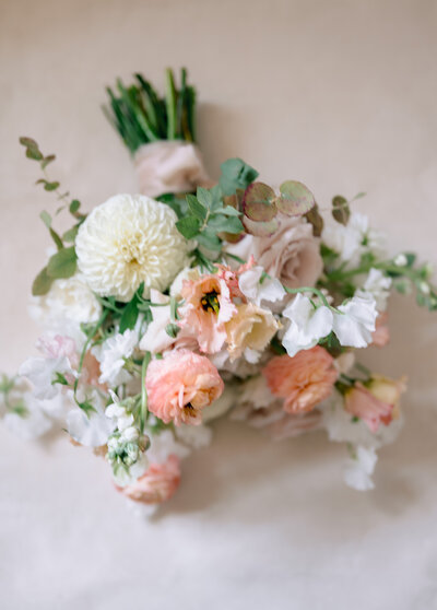 A bouquet of fresh flowers of white- pink-and greens