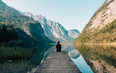 Mountains vast land scape man overlooking scenic view