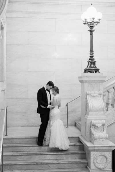 A bride and groom pose for their wedding photos inside the Ohio Statehouse