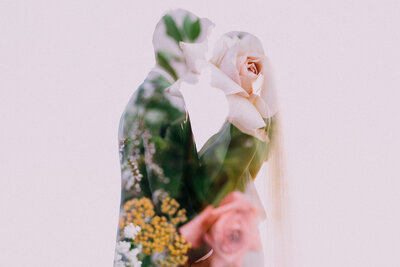 a double exposure of a wedding couple with the bride's bouquet