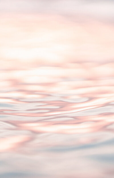 Close up of water surface. Pink coloured