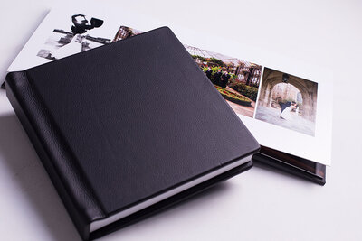 Two wedding albums on a white background