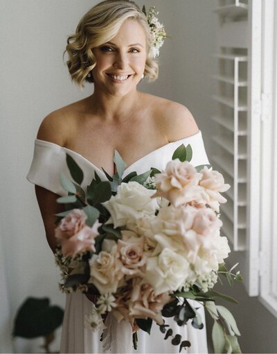 bride holding a bouquet hair and makeup by eva hair and makeup sydney