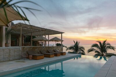 La Joya Sayulita is a secluded oceanside retreat resort in Nayarit offering boutique accommodations, wellness retreats, and local adventure experiences in a serene coastal setting.