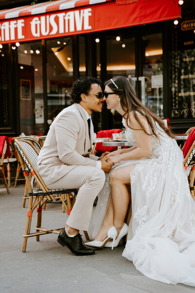 Couple eloping in front of Cafe Gustave in Paris