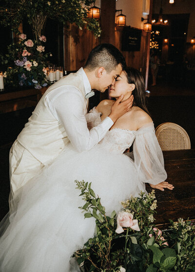 Bride and groom about to kiss each other at their wedding