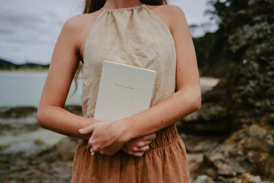 woman with hands in air