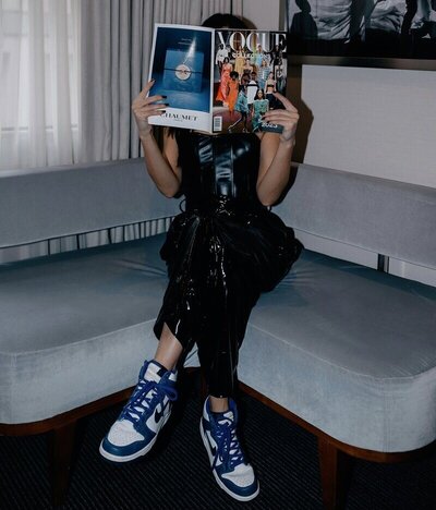 Amanda Vargus, personal stylist, holding a Vogue magazine