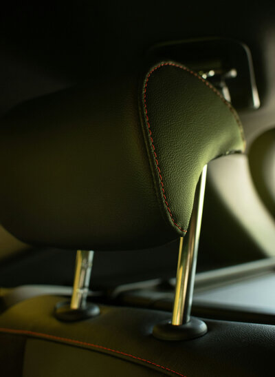 Close-up of a car seat headrest with stitching