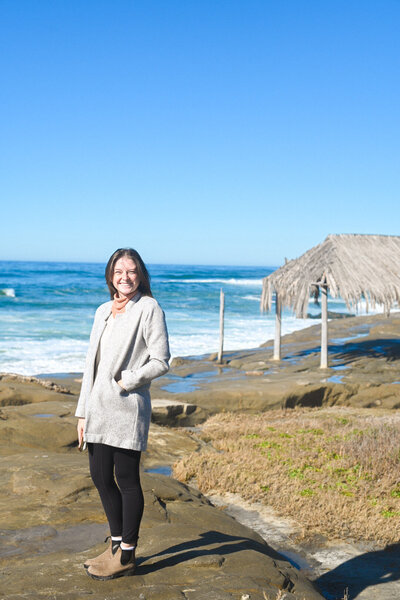 kacy beck in front of Belem Tower in portugal