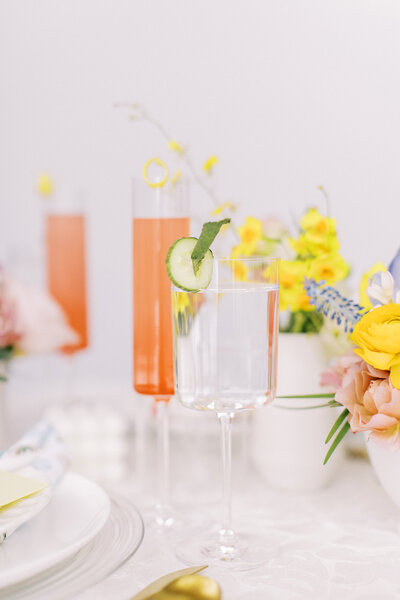 close up detail shot of wine glasses with table setting and florals at a Calgary wedding photographed by Calgary wedding photographers Heidrich Photography