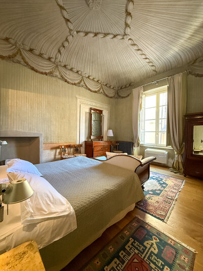 Large bedroom at the Guinigi Apartment in Lucca, Italy