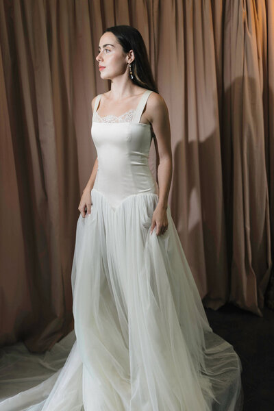 black and white image bride wearing feathered wedding dress