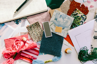 St. Louis Interior Design Mood Board with swatches, yarn, pieces of cloth, and a notebook.