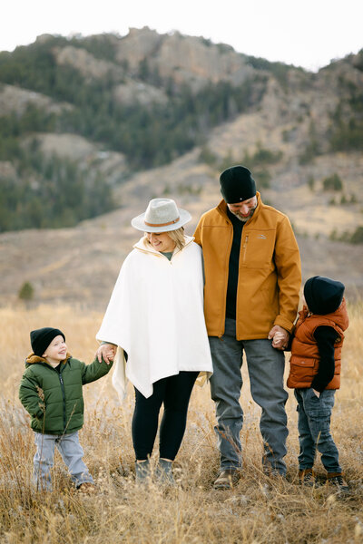 A family smiles during their Family Photoshoot in Lory State Park, Fort Collins, Colorado.