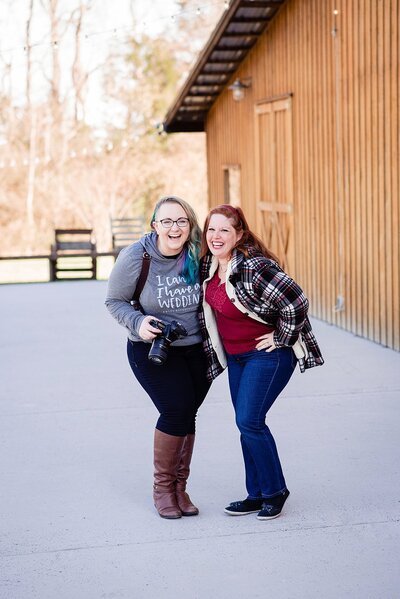 Wedding planner and officiant standing with elopement photographer laughing at the camera
