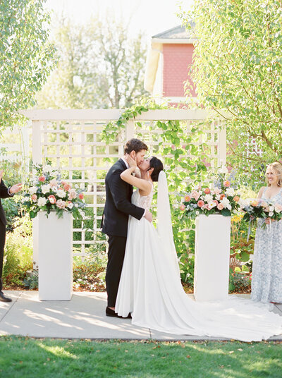 Bride and groom on a balcony outside in vancouver, canada