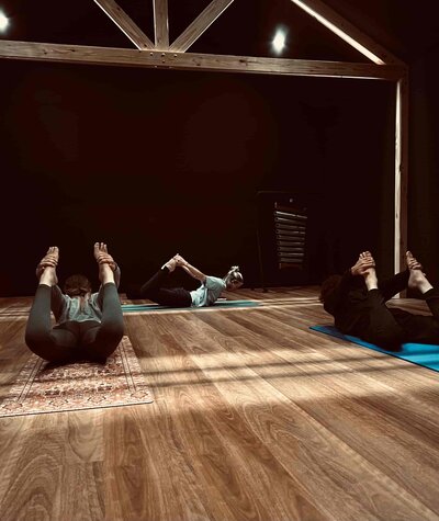 vinyasa yoga class doing back bend