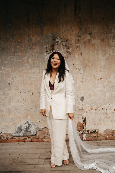 bride wearing a suit at a collingwood childrens farm wedding