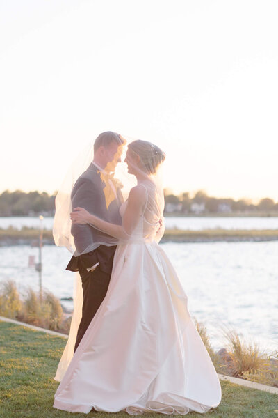 Bride and Groom by the Chesapeake Bay on Kent Island. Taken by Washington DC Wedding Photographer Bethany Aubre Photography.