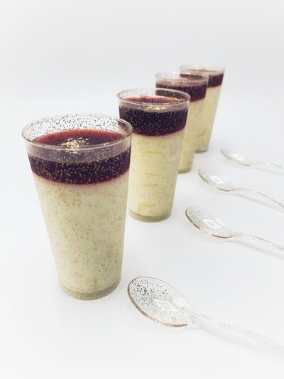 strawberry cheesecake in gold flecked shot glasses