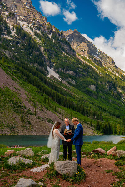 Wedding ceremony at Maroon Bells in Aspen Colorado in the spring.