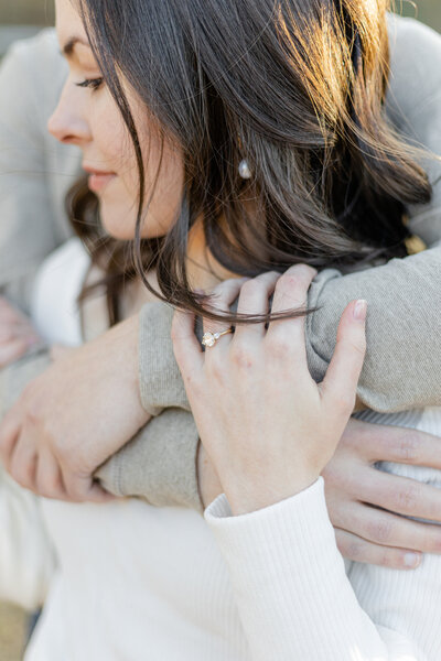 Engaged couple zoomed in showing Engagement ring