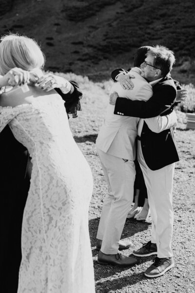 Bride & groom hug their parents after their elopement ceremony in Crested Butte, Colorado.