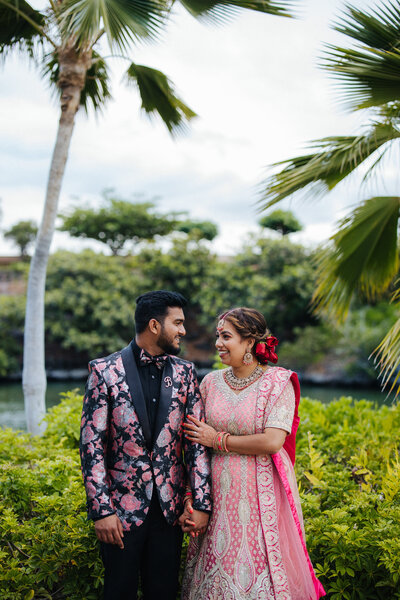 Indian wedding at the Hilton Waikoloa Village, featuring vibrant cultural traditions and elegant wedding details, capturing the essence of a luxury destination celebration in Hawaii." Photographed by Couple Cups