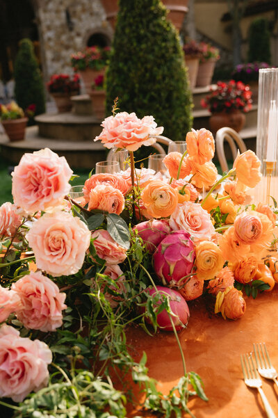 Exquisite wedding floral arrangement featuring vibrant blooms and lush greenery, elegantly designed to complement the romantic atmosphere of the wedding day.