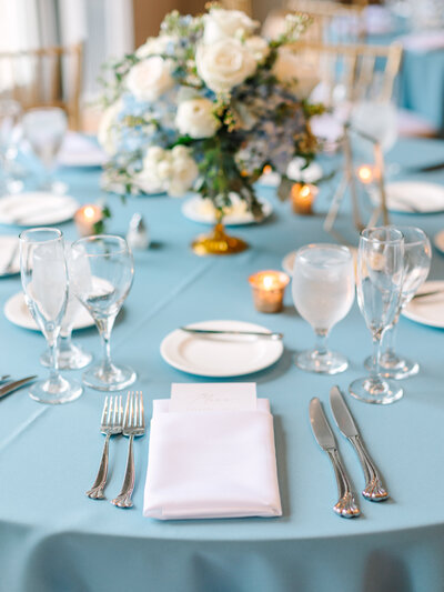 Place setting at wedding reception with florals